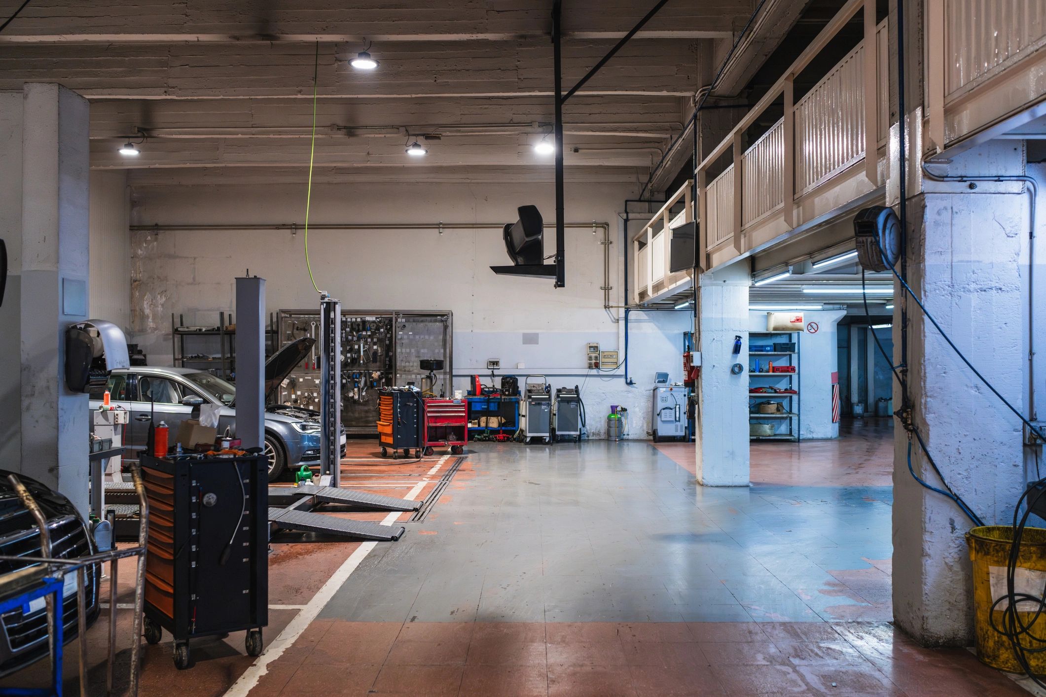 Service bays and lifts inside an auto repair shop