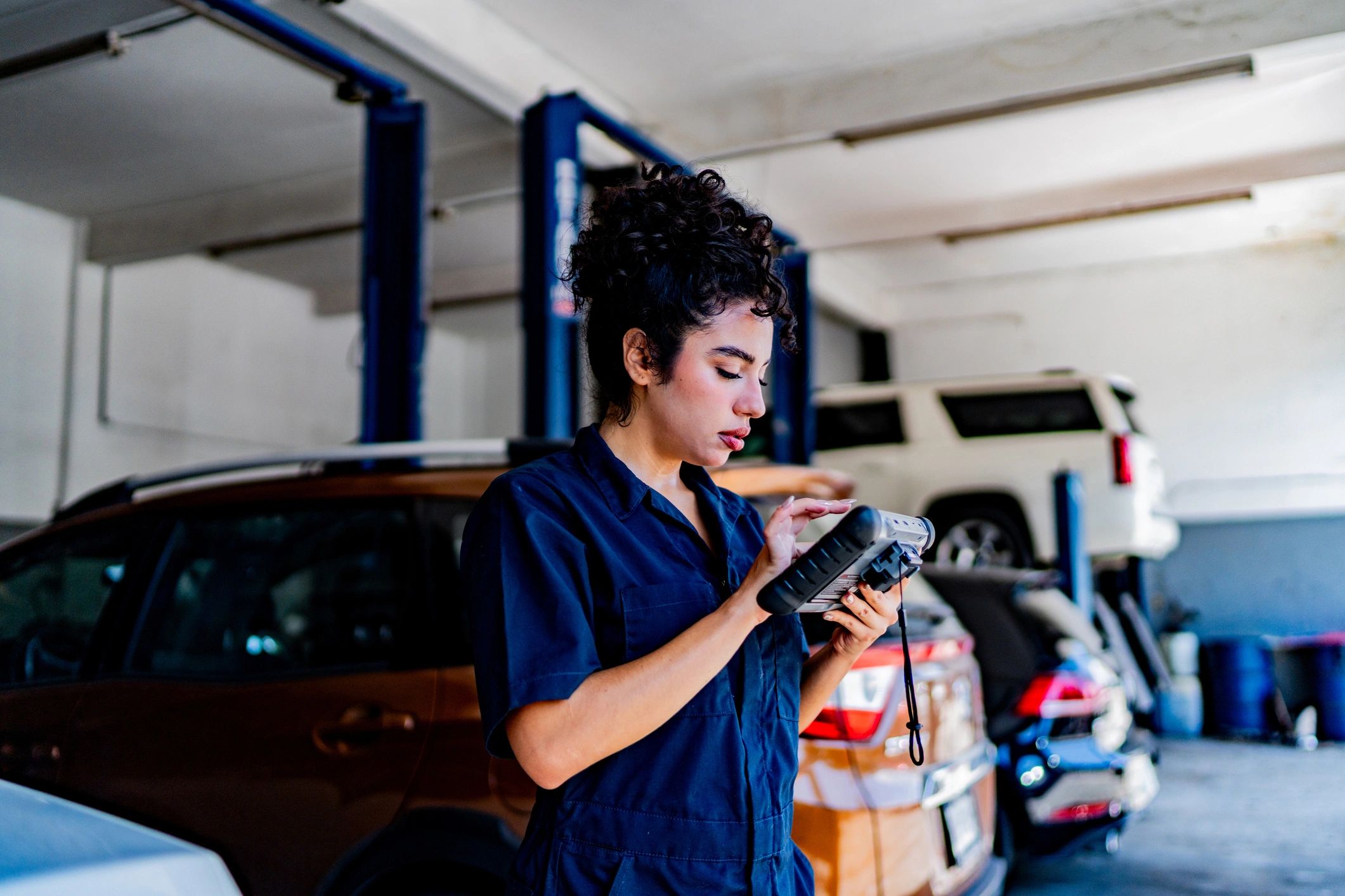 Technician using a scan tool during a diagnostic check